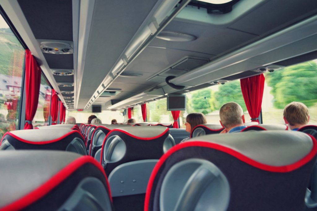 People traveling with the bus.